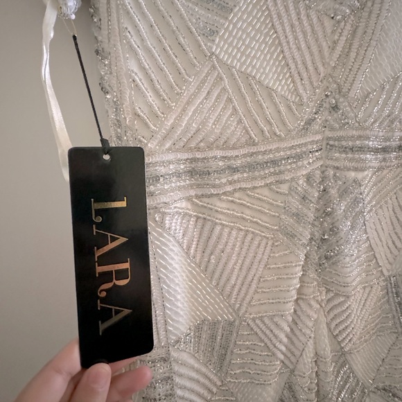 LARA Designs size 16. Dress is white sequined w/white and silver sequins. - Picture 3 of 5